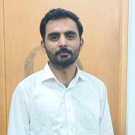 A professional headshot of Muhammad Ramzan.